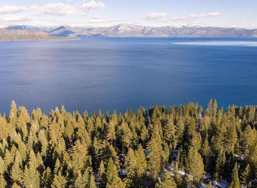 Experience breathtaking views of the lake and mountains from this stunning property.