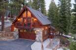 This stunning cabin-style home offers a perfect blend of rustic charm and modern convenience.