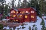 Nestled in a serene forest setting, this stunning property boasts a multi-level design with expansive decks, perfect for enjoying the surrounding natural beauty.