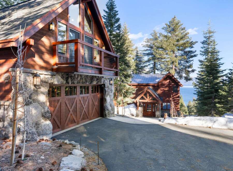 This stunning mountain home boasts a beautiful exterior with a combination of wood and stone.