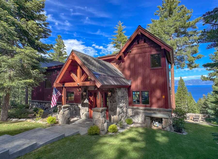 Experience breathtaking lake views from this stunning mountain retreat, nestled amongst towering pine trees.