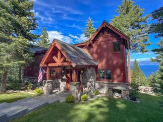 Experience breathtaking lake views from this stunning mountain retreat, nestled amongst towering pine trees.