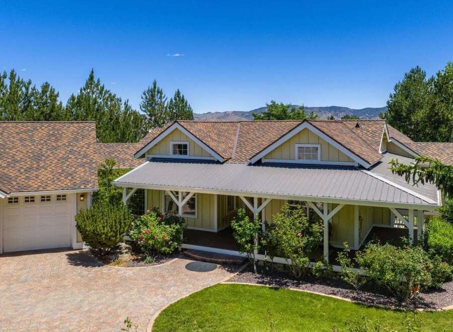 Discover this charming home featuring a welcoming covered porch perfect for enjoying the outdoors.