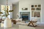 Experience modern comfort in this beautifully appointed living room, featuring a sleek fireplace as the focal point.