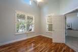 Step into this inviting room featuring gleaming hardwood floors and abundant natural light.
