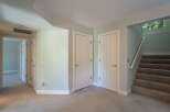 Discover comfortable living in this home featuring a well-lit hallway with multiple doors leading to various rooms.