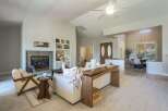 Step into this inviting living space featuring a cozy fireplace and ample natural light.
