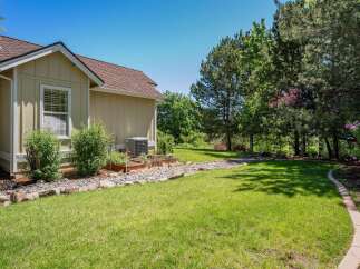 Discover this charming home featuring a well-maintained exterior with a light-colored siding and a classic shingle roof.