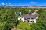 Nestled amidst lush greenery and mature trees, this stunning property offers a serene retreat with breathtaking mountain views.