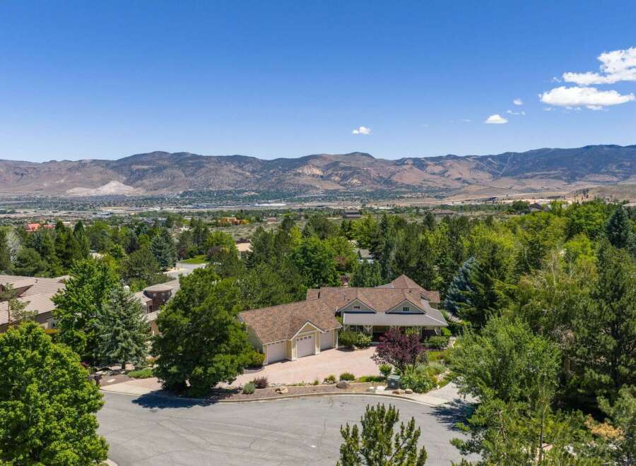Nestled amidst lush greenery, this stunning property offers a serene retreat with breathtaking mountain views.