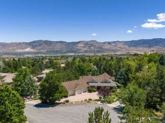 Nestled amidst lush greenery, this stunning property offers a serene retreat with breathtaking mountain views.