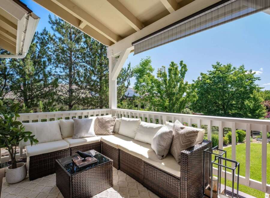 Enjoy the outdoors from this charming covered patio, perfect for relaxing or entertaining.