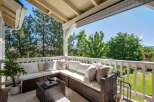 Enjoy the outdoors from this charming covered patio, perfect for relaxing or entertaining.