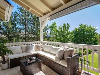 Enjoy the outdoors from this charming covered patio, perfect for relaxing or entertaining.