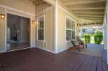 Step onto the inviting covered porch, perfect for enjoying your morning coffee or evening relaxation.
