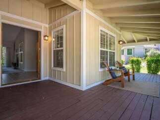 Step onto the inviting covered porch, perfect for enjoying your morning coffee or evening relaxation.