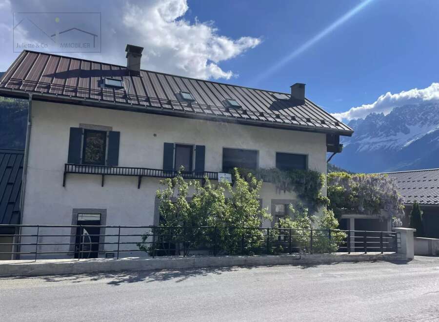 Charming property with a distinctive metal roof, offering a blend of classic design and modern appeal.