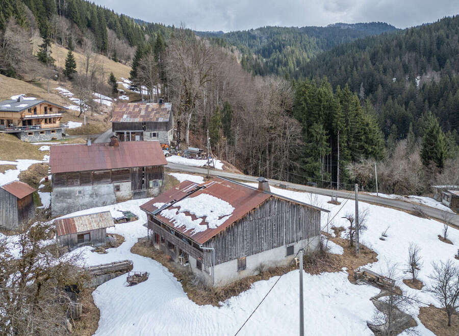 Nestled in a picturesque mountain setting, this property offers a unique blend of rustic charm and natural beauty.