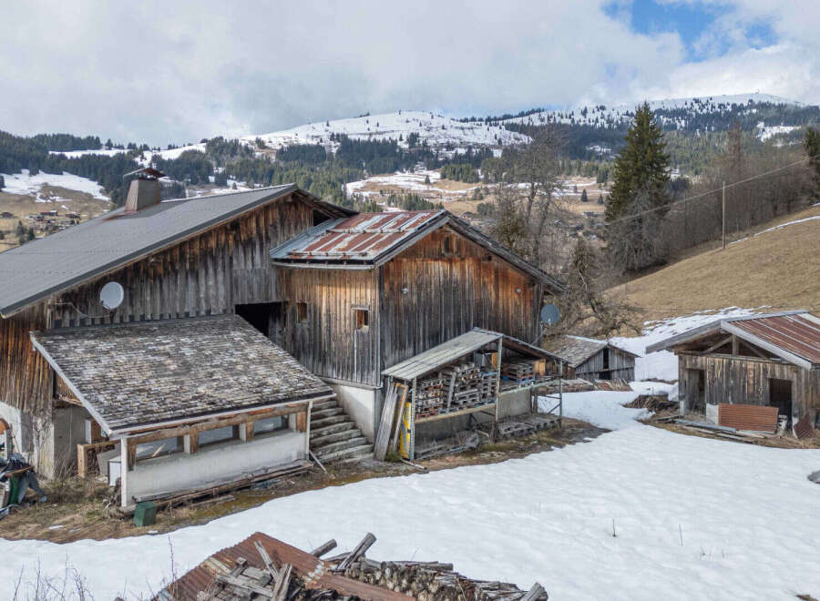 Nestled in a serene mountain landscape, this rustic property offers a unique blend of charm and tranquility.