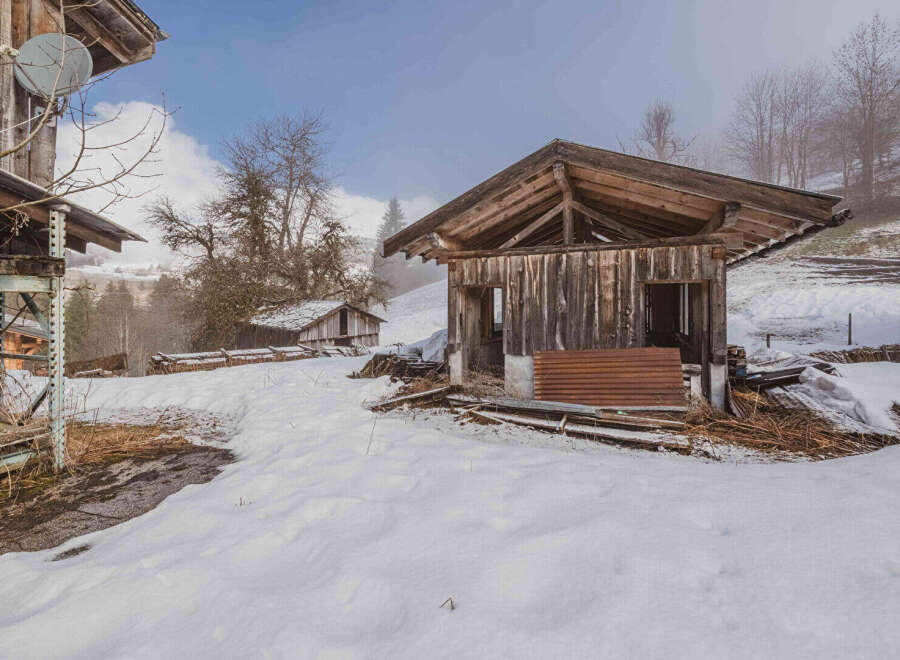 Discover a rustic retreat nestled in a serene, snow-covered landscape.