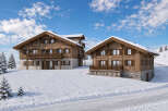 Experience luxurious mountain living in these stunning wooden chalets, nestled in a picturesque snowy landscape.