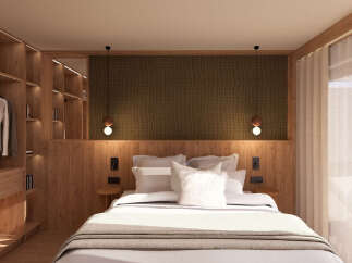 Experience luxury in this stunning bedroom featuring a custom-built wooden closet and a cozy bed.