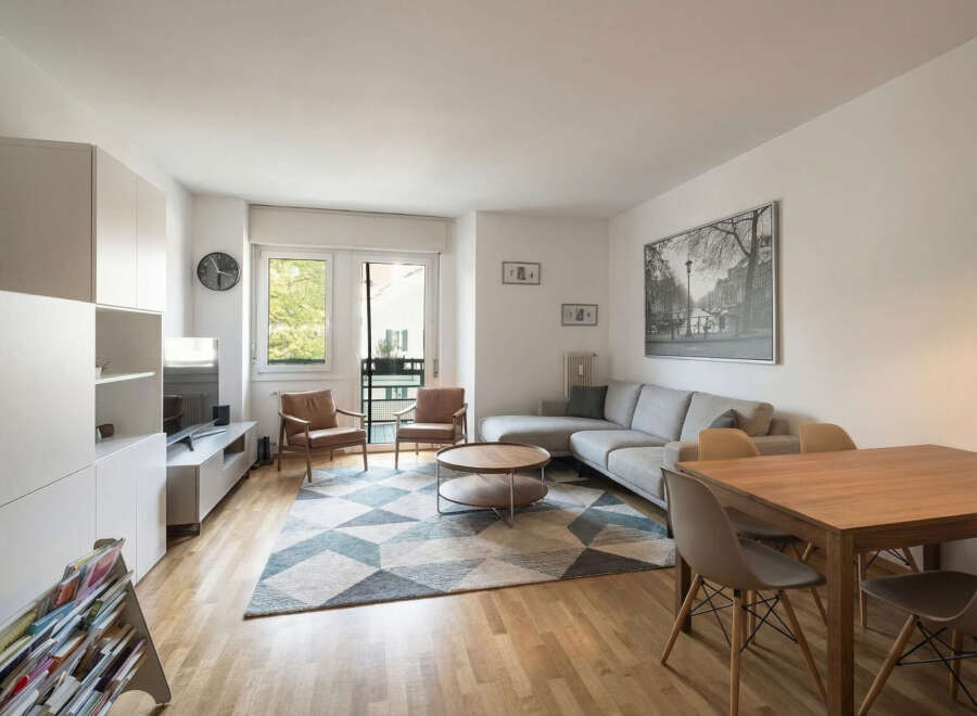 This stunning living space boasts a modern design with a comfortable sectional sofa and a stylish coffee table.