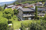 Discover your dream home nestled in a serene, green landscape.