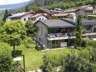 Discover your dream home nestled in a serene, green landscape.