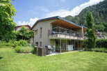 Discover modern living in this stunning property featuring a sleek design and expansive glass walls.