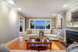 This stunning living room boasts a cozy fireplace, perfect for chilly evenings.