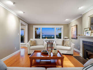 This stunning living room boasts a cozy fireplace, perfect for chilly evenings.