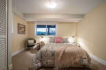 This cozy bedroom offers a serene retreat with its inviting ambiance.