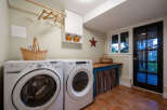 This charming laundry room features a modern washer and dryer set, perfect for efficient home management.