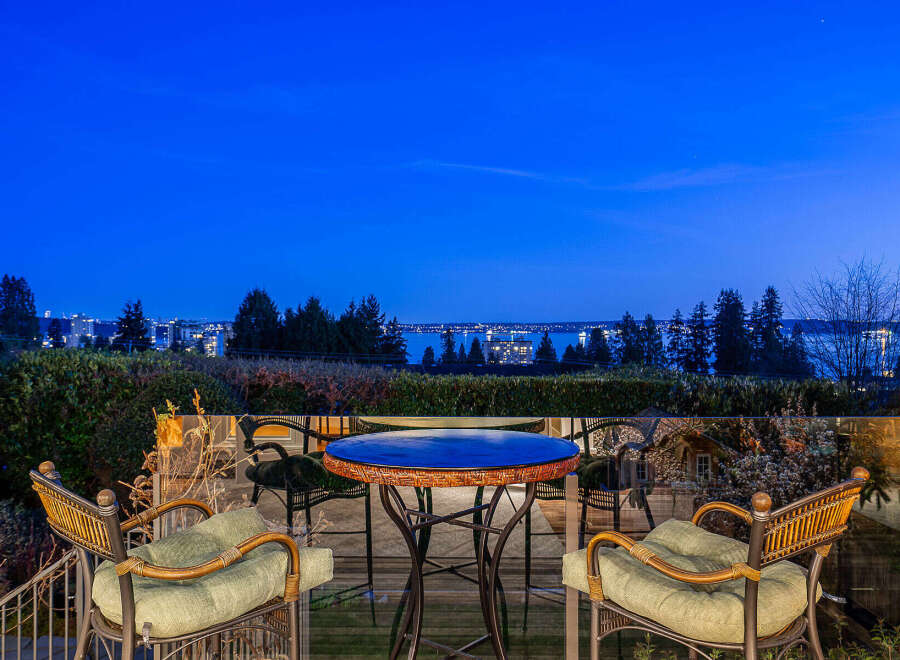 Enjoy breathtaking views from this stunning property! This home features a beautiful outdoor patio with comfortable seating, perfect for relaxing and entertaining.