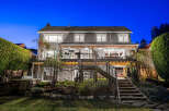 This stunning property boasts a beautifully designed exterior, perfect for evening gatherings.