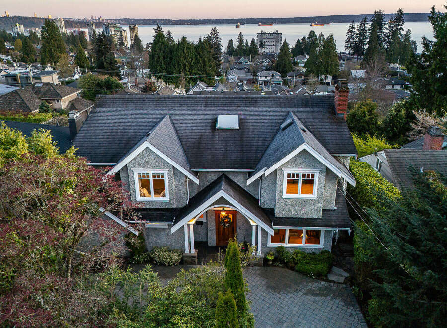 This stunning property boasts a classic design with a charming exterior and a welcoming entrance.