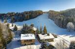 Discover a charming chalet nestled in a winter wonderland, offering a perfect blend of rustic charm and modern comfort.