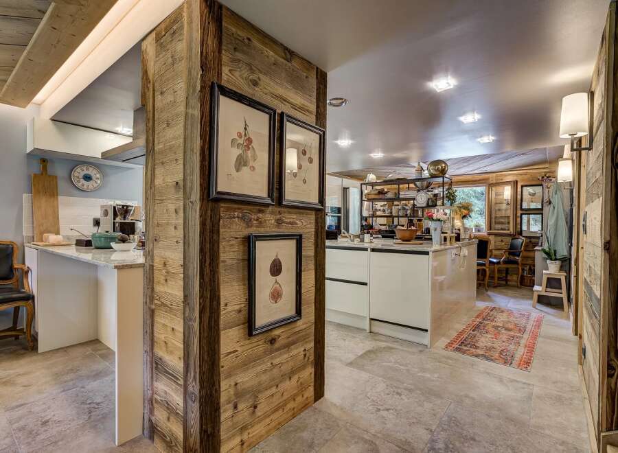 This stunning kitchen boasts a rustic charm with its wooden accents and modern amenities.