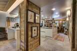This stunning kitchen boasts a rustic charm with its wooden accents and modern amenities.