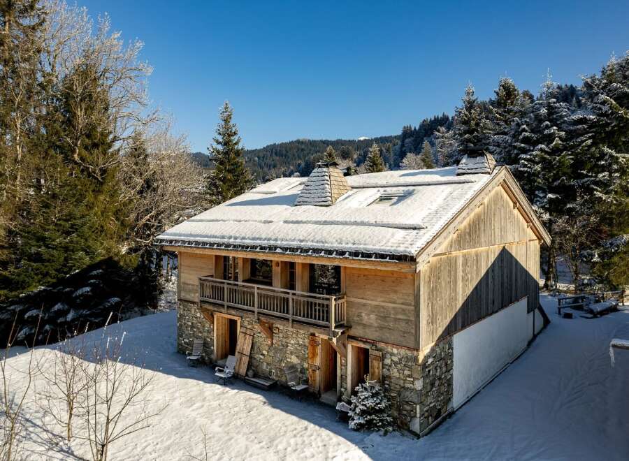 Discover the charm of this stunning chalet nestled in a winter wonderland.