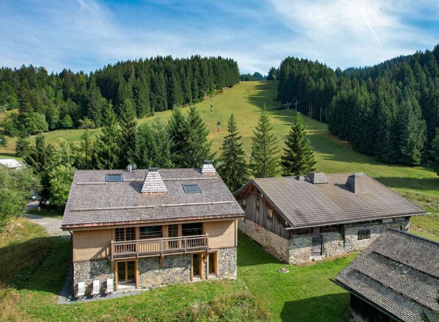 Nestled in a picturesque mountain setting, this stunning property offers a blend of rustic charm and modern comfort.