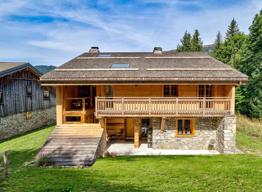 Discover the charm of this stunning wooden chalet nestled in a picturesque setting.