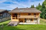 Discover the charm of this stunning wooden chalet nestled in a picturesque setting.