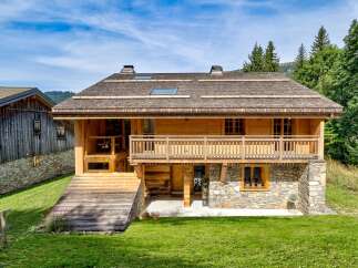 Discover the charm of this stunning wooden chalet nestled in a picturesque setting.