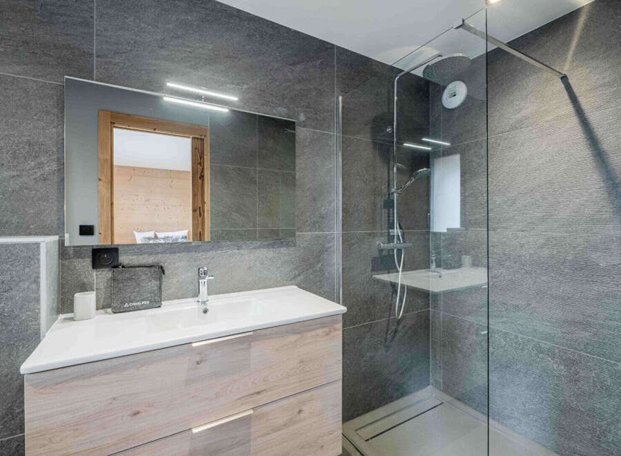 Step into a modern bathroom oasis, featuring sleek design and high-end finishes.