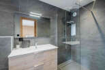 Step into a modern bathroom oasis, featuring sleek design and high-end finishes.