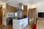 This stunning apartment boasts a fully equipped kitchen with modern appliances and ample counter space, perfect for preparing delicious meals.