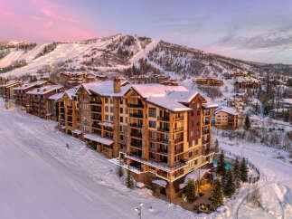 Experience luxury living at this stunning ski-in/ski-out property, featuring breathtaking mountain views and direct access to the slopes.