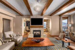 This stunning living room boasts a cozy fireplace, perfect for chilly evenings.